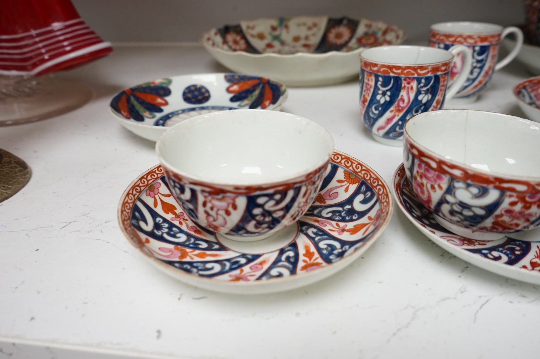 A Worcester Lord Henry Thynne type fluted tea bowl and saucer, c.1780, a group of Worcester Queen Charlotte pattern tea and coffee wares, c.1790-1810, two Worcester Kakiemon style dishes, largest 21cm in diameter